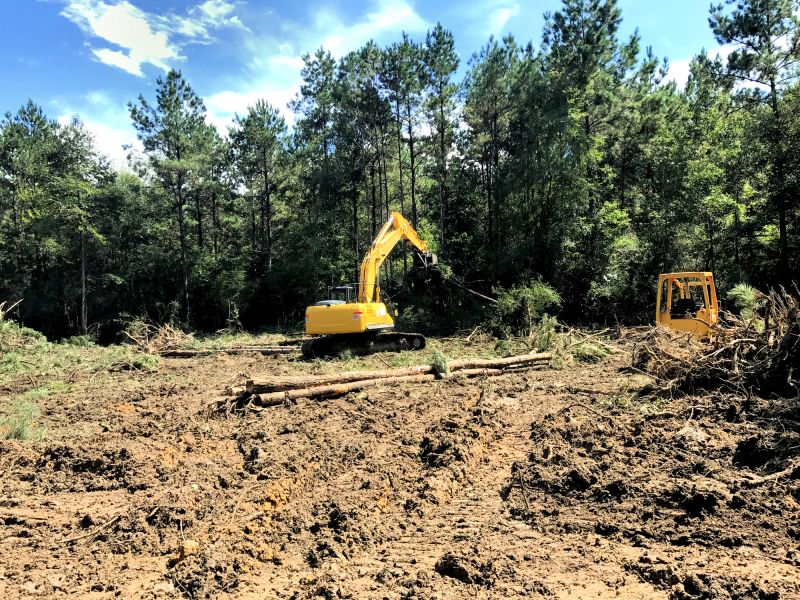 Heavy Equipment Clearing Land